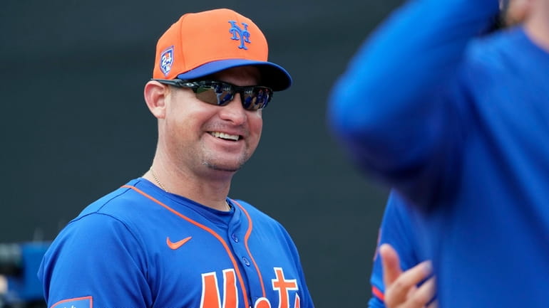 New York Mets manager Carlos Mendoza smiles during a spring...