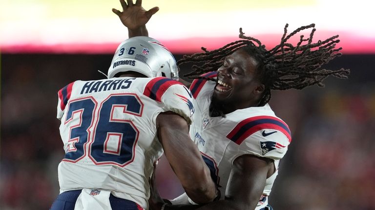 New England Patriots running back Kevin Harris (36) is congratulated...