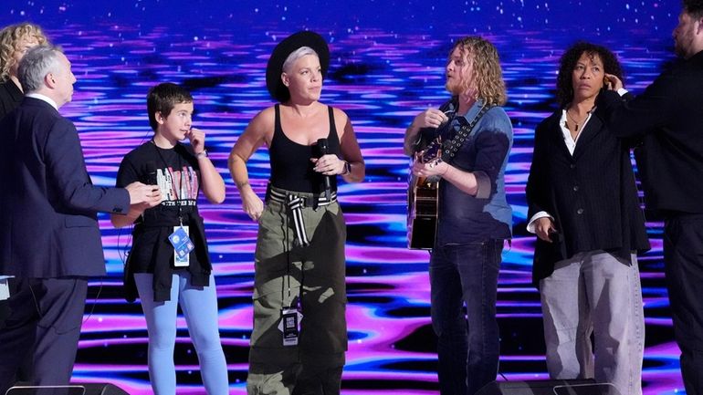 Pink, center, stands on stage during a sound check before...