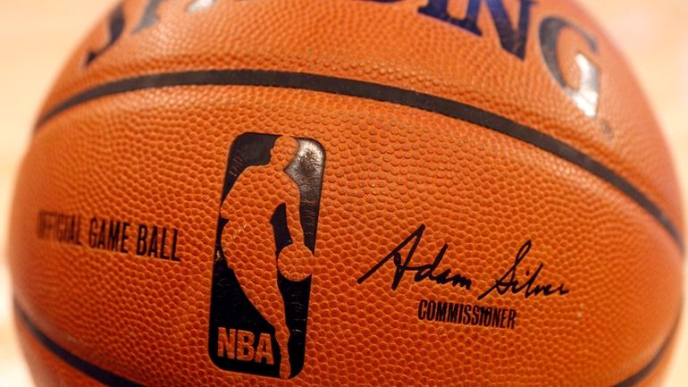 An NBA logo is seen on an official game ball...