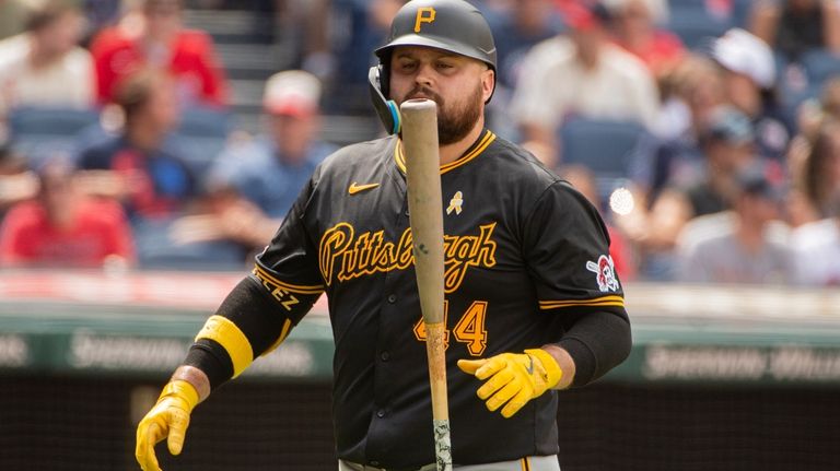 Pittsburgh Pirates' Rowdy Tellez walks back to the dugout after...