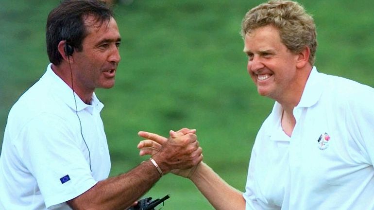 European Ryder Cup team captain Seve Ballesteros congratulates Scotland's Colin...