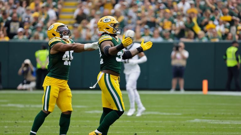 Green Bay Packers linebacker Rashan Gary (52) celebrates with linebacker...