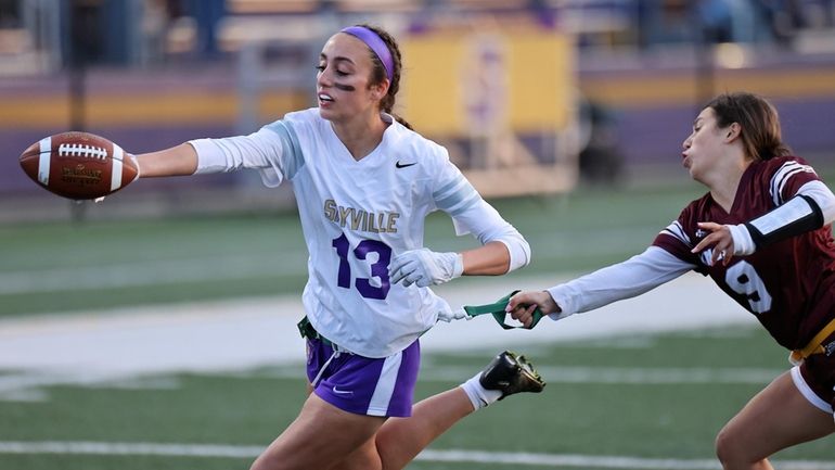 Sayville WR Lindsay DiMenna takes the ball to the Kings...