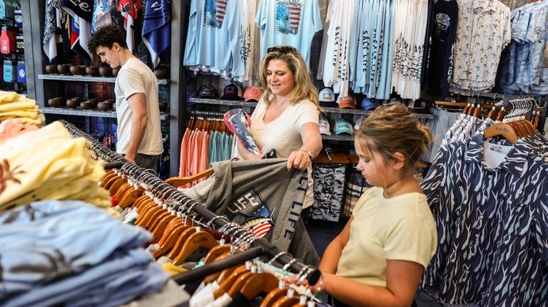 Susan Lombardi of Brightwaters shops with her children Andrew, 17,...