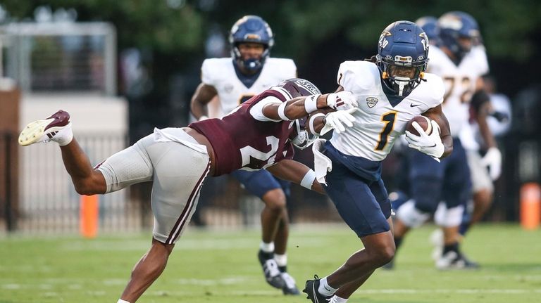 Toledo wide receiver Jerjuan Newton (1) looks for yards after...