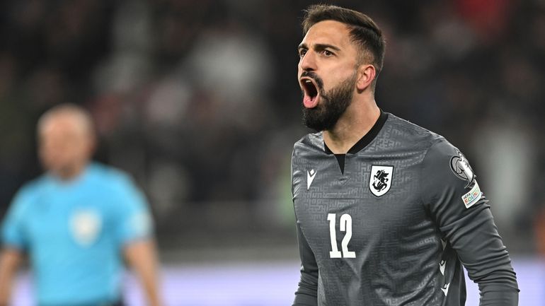 Georgia goalkeeper Giorgi Mamardashvili reacts after his save during a...