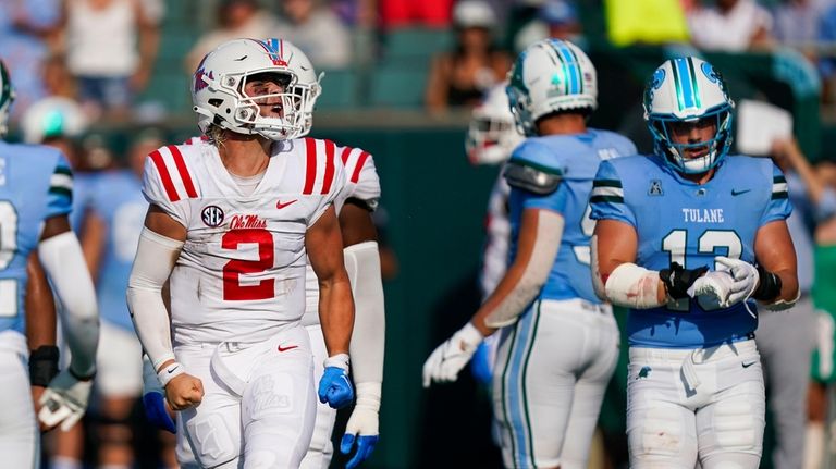 Mississippi quarterback Jaxson Dart (2) reacts after rushing for a...