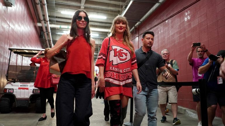 Taylor Swift arrives before the start of an NFL football...