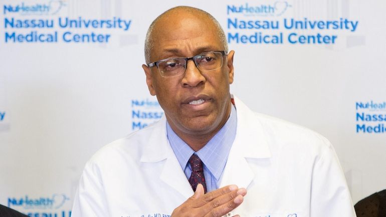 Dr. Anthony Boutin speaks during a news conference at Nassau...