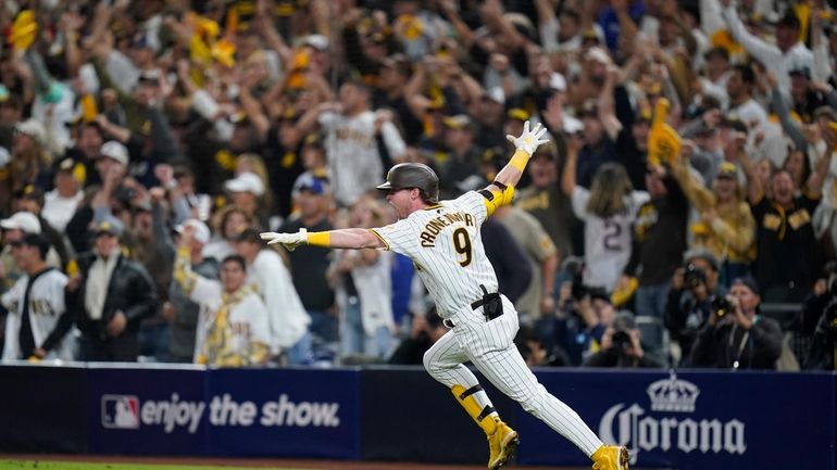 San Diego Padres' Jake Cronenworth reacts after hitting a two-run...