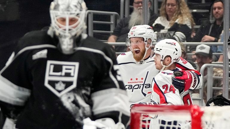 Washington Capitals right wing Anthony Mantha, center, celebrates his goal...