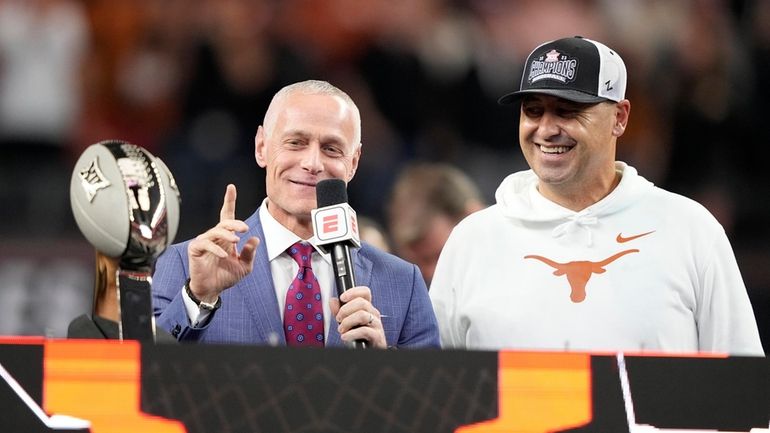 Big 12 Commissioner Brett Yormark, left, stands by Texas head...