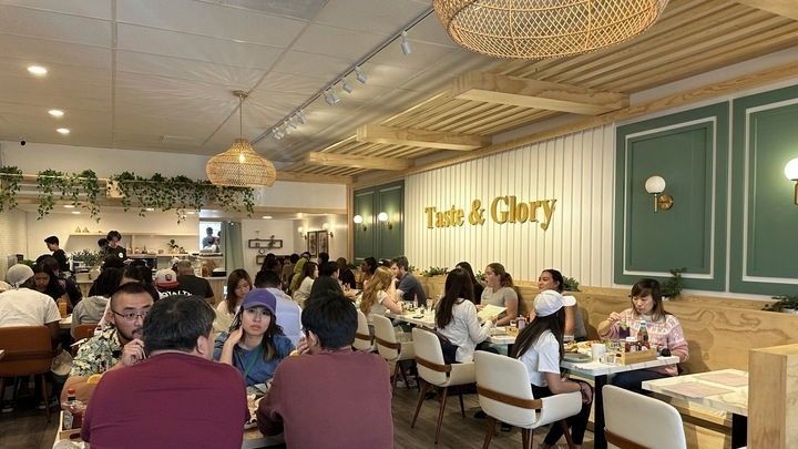 Customers eat weekend brunch items at Taste & Glory restaurant...