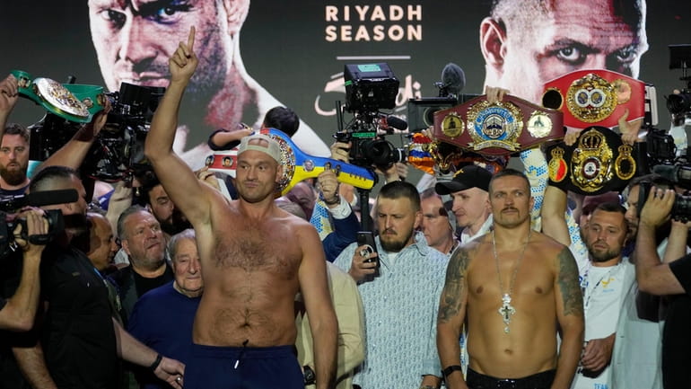 Heavyweight boxers Britain's Tyson Fury, left, and Ukraine's Oleksandr Usyk...