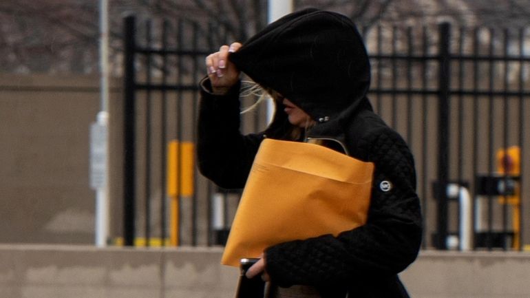 Former auto shop owner Lorraine Pilitz leaves the federal courthouse in...