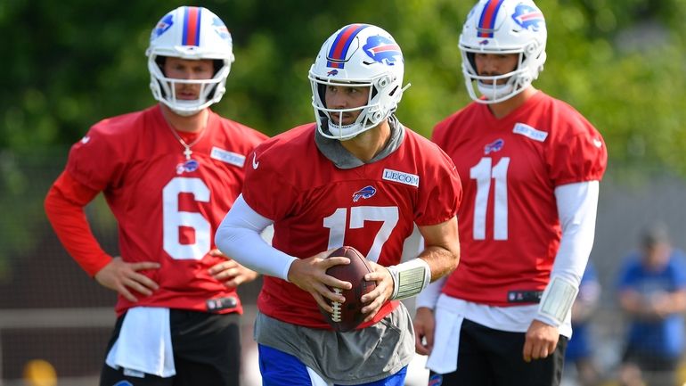 Buffalo Bills quarterback Josh Allen (17) runs a drill as...