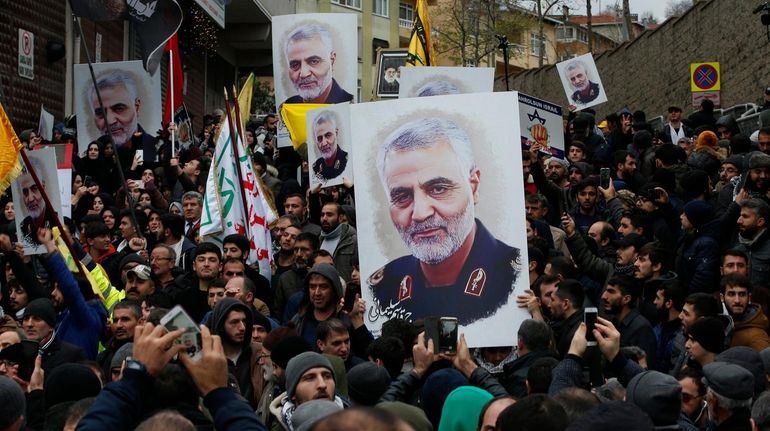 Protesters gather during a demonstration against the killing of Iranian...