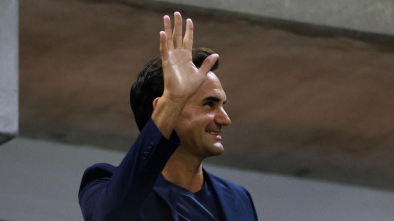 Tennis great Roger Federer waves to the crowd during the...