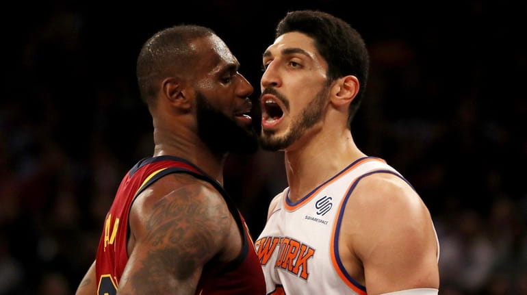 The Cavaliers' LeBron James and Knicks center Enes Kanter exchange...