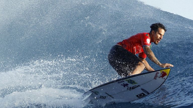 Surfer Italo Ferreira of Brazil competes on his way to...