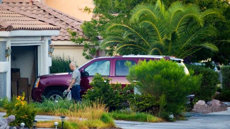 Outgoing Clark County Public Administrator Robert Telles washes his car...