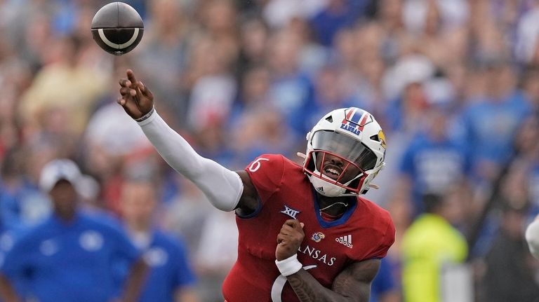 Kansas quarterback Jalon Daniels passes the ball during the first...