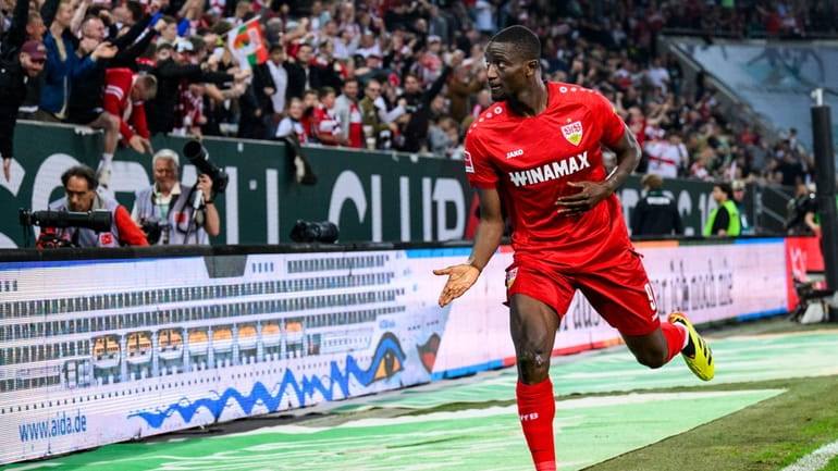 Stuttgart's Serhou Guirassy celebrates scoring during the Bundesliga soccer match...