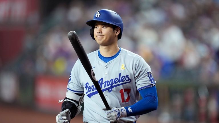 Los Angeles Dodgers designated hitter Shohei Ohtani, of Japan, walks...