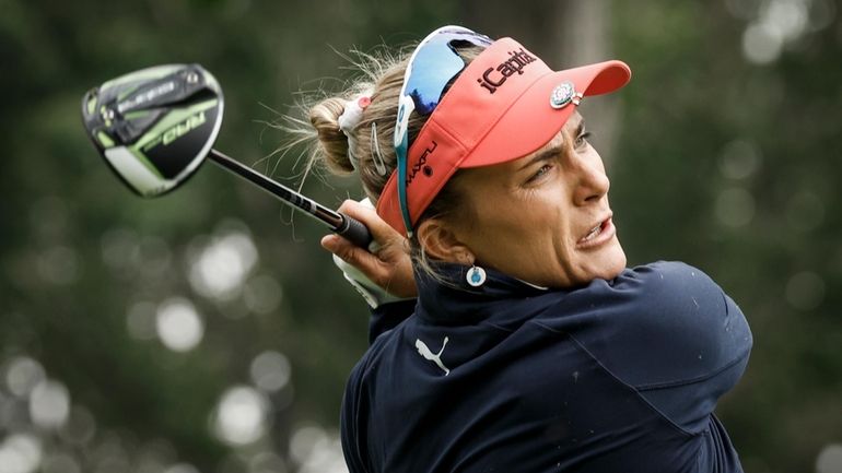 Lexi Thompson, of the United States, hits a tee shot...