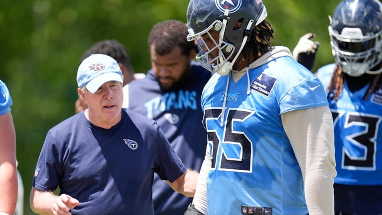 Tennessee Titans offensive line coach Bill Callahan gives instructions to...