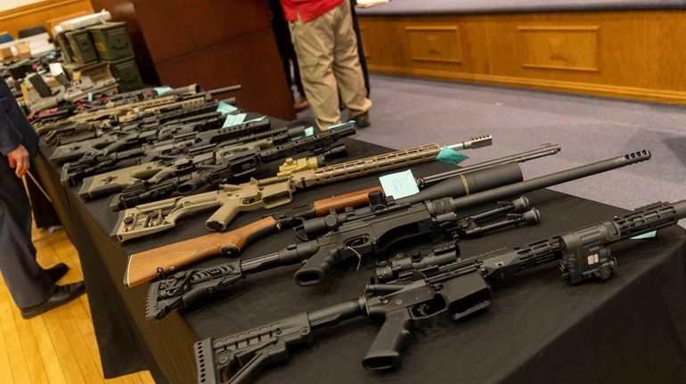 Ghost guns on display at a news conference in Mineola...