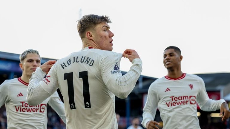 Manchester United's Rasmus Hojlund celebrates after scoring his side's opening...