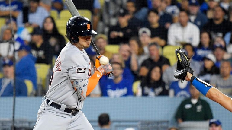 Detroit Tigers' Zach McKinstry is hit by a pitch during...