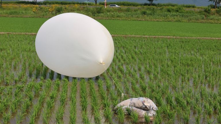 A balloon presumably sent by North Korea, is seen in...