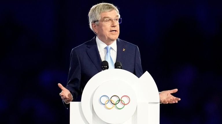 IOC President Thomas Bach addresses the audience during the 2024...