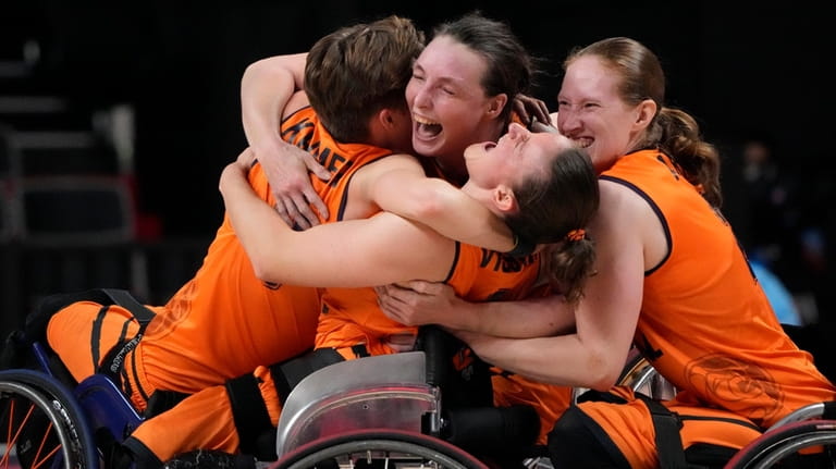 Player from Netherlands celebrate after defeating Germany in a women's...