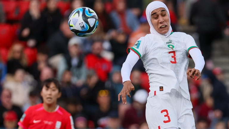 Morocco's Nouhaila Benzina heads the ball during the Women's World...