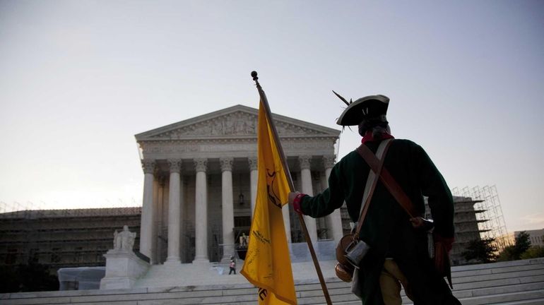 William Temple, of Brunswick, Ga., waits outside the Supreme Court...