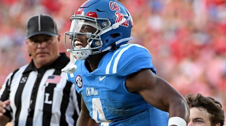 Mississippi running back Quinshon Judkins (4) reacts after a run...