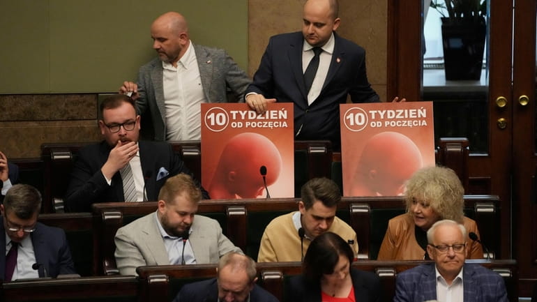 Dariusz Matecki, top right, a conservative lawmaker in the Polish...