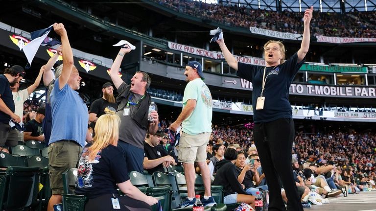 A Boeing machinist and union member leads cheers during the...