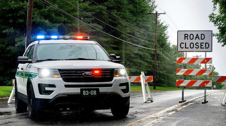 Stonebridge Crossing Road is closed near near Houghs Creek in...