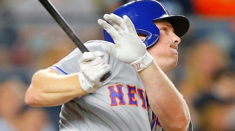 Some rival executives believe Jay Bruce, above homering at Yankee...