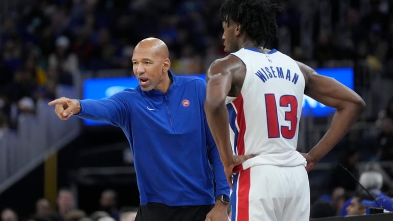 Detroit Pistons coach Monty Williams, left, gestures while talking to...