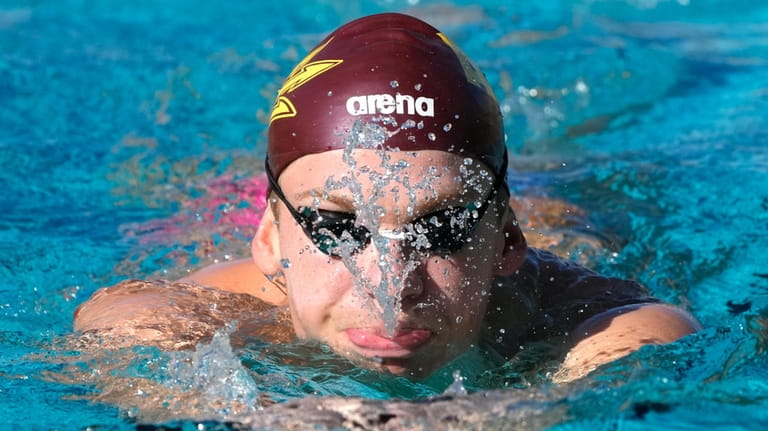 French Olympic swimmer Leon Marchand trains with his Arizona State...