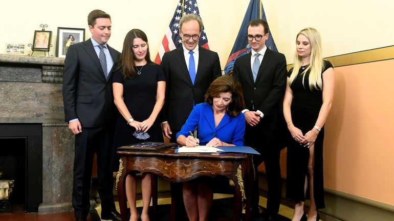 Family members, from left, Matt Gloudeman; Katie Hochul; Bill Hochul;...