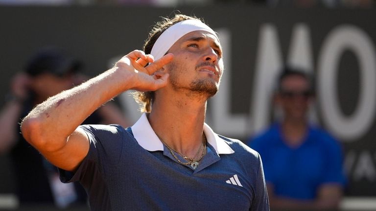 Germany's Alexander Zverev celebrates winning a set against Chile's Alejandro...