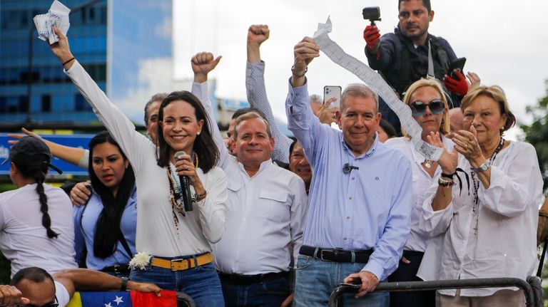 Opposition leader Maria Corina Machado, left, and opposition candidate Edmundo...