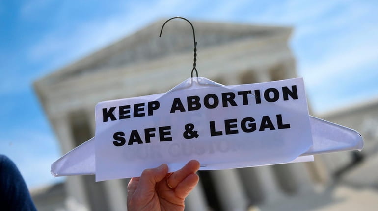 Abortion rights activists rally in front of the U.S. Supreme...